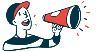 A person wearing a baseball cap speaks using a megaphone.