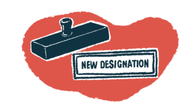 A rubber stamp hovers over the words 'new designation'